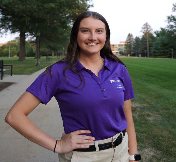 Alanna wearing purple polo