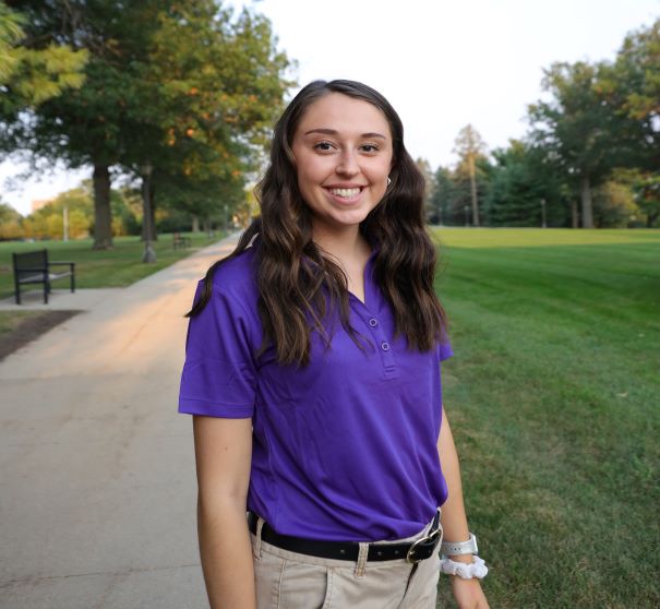 Allison wearing purple polo