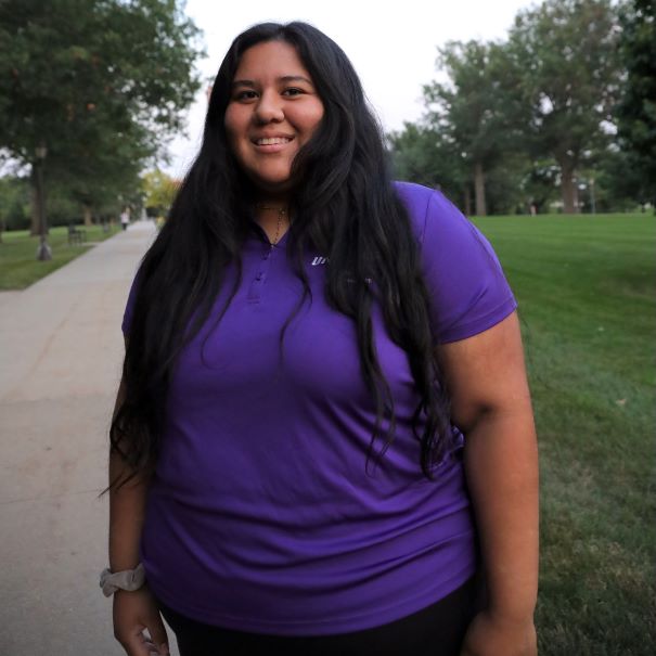 Alondra wearing purple polo