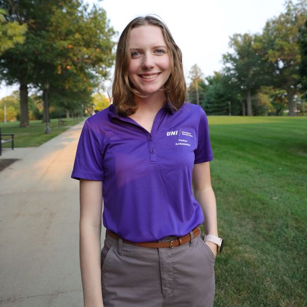 Caroline wearing purple polo
