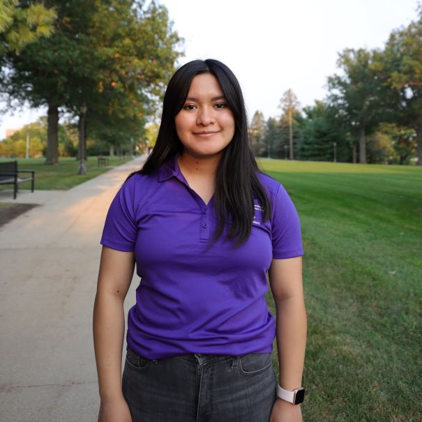 Dulce wearing purple polo