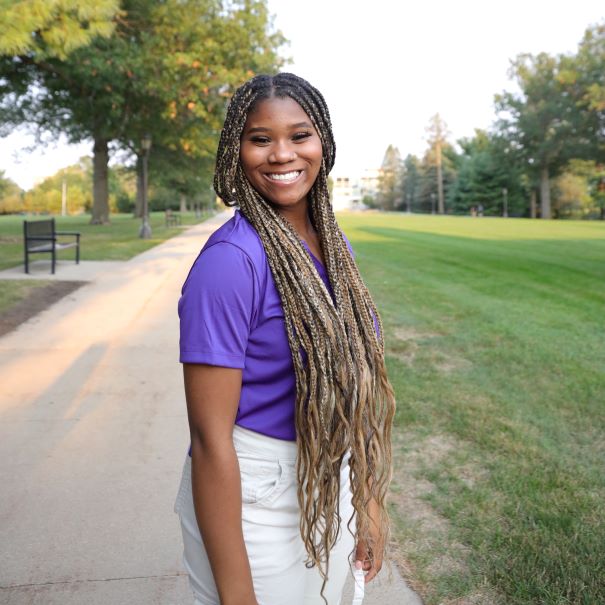 Javaria wearing purple polo