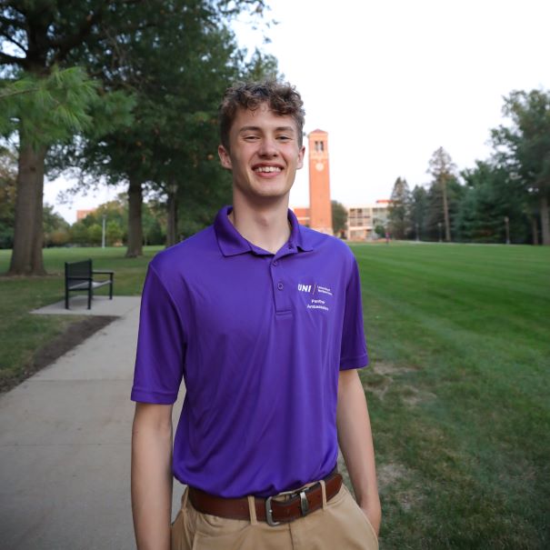Jonah wearing purple polo