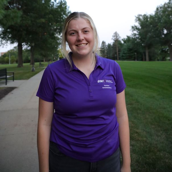 Josie wearing a purple polo