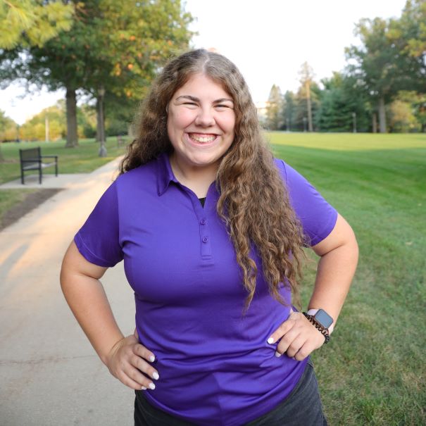 Kenzie wearing purple polo