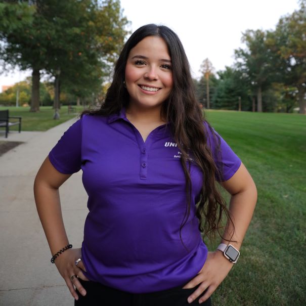 Lizbeth wearing a purple polo