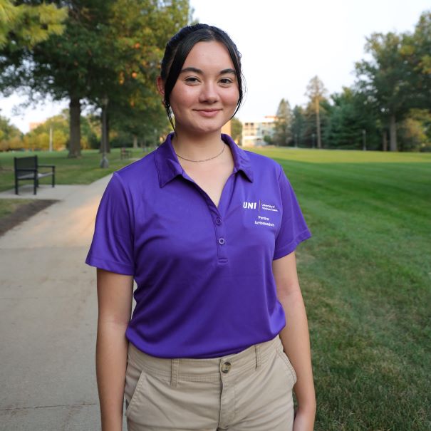 Madison wearing a purple polo