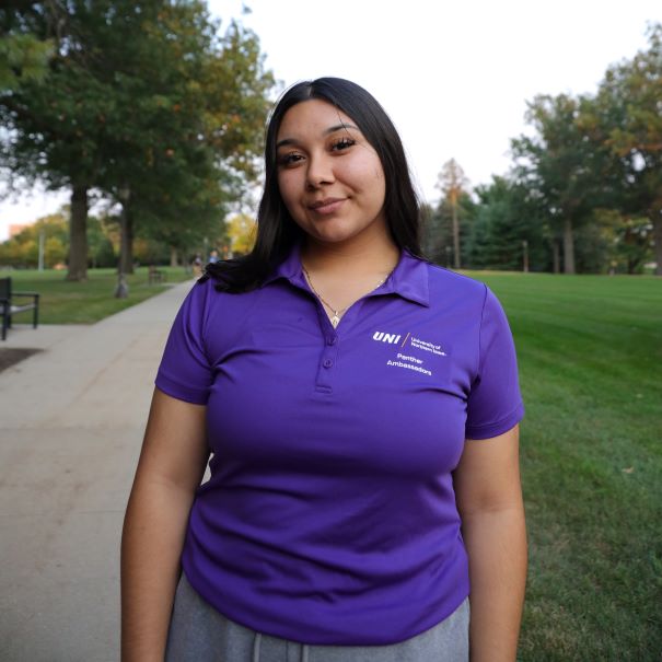 Mayela wearing purple polo