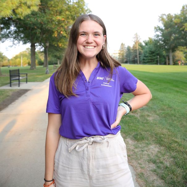 Morgan wearing purple polo