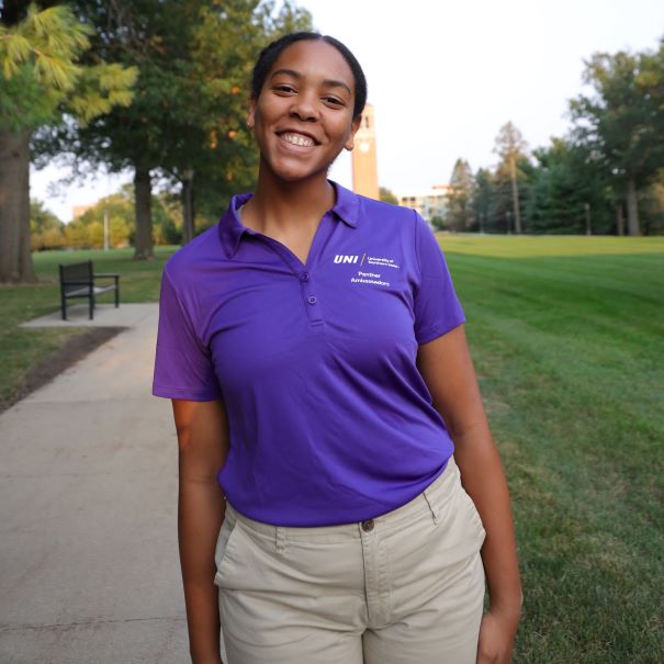 Myranda wearing purple polo