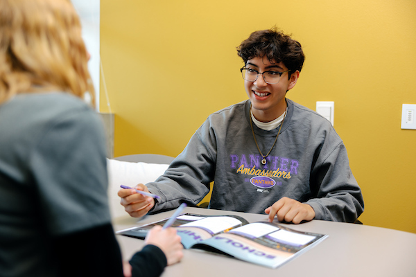 Student meeting with admission counselor
