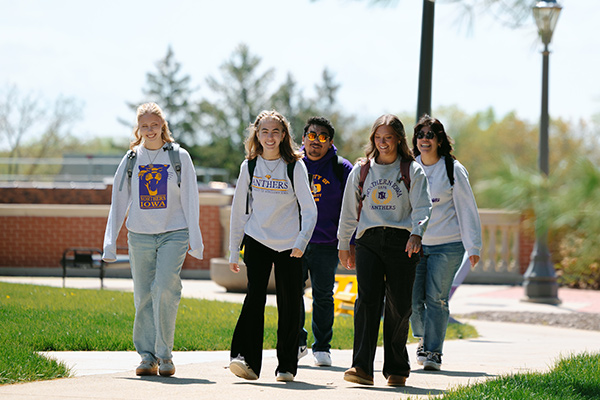 Group of students walking on campus