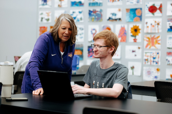 Professor working with student