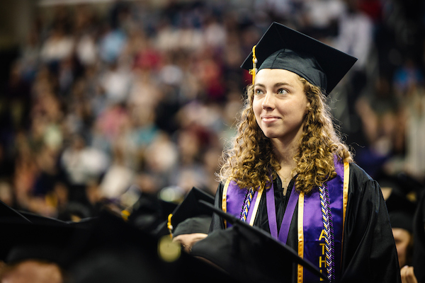 Female student at a Commencement ceremony in McLeod Center.