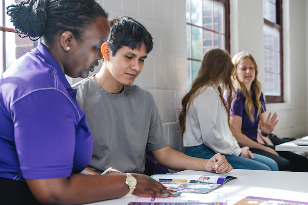 Student working with admissions counselor