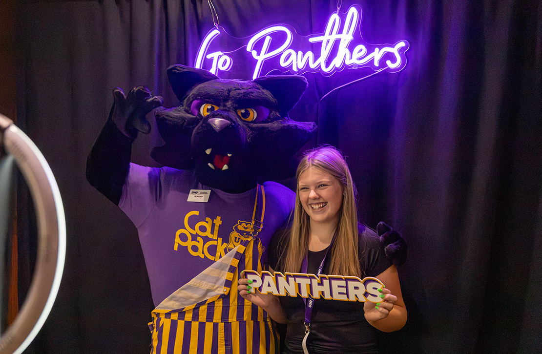 TC Panther and student posing together