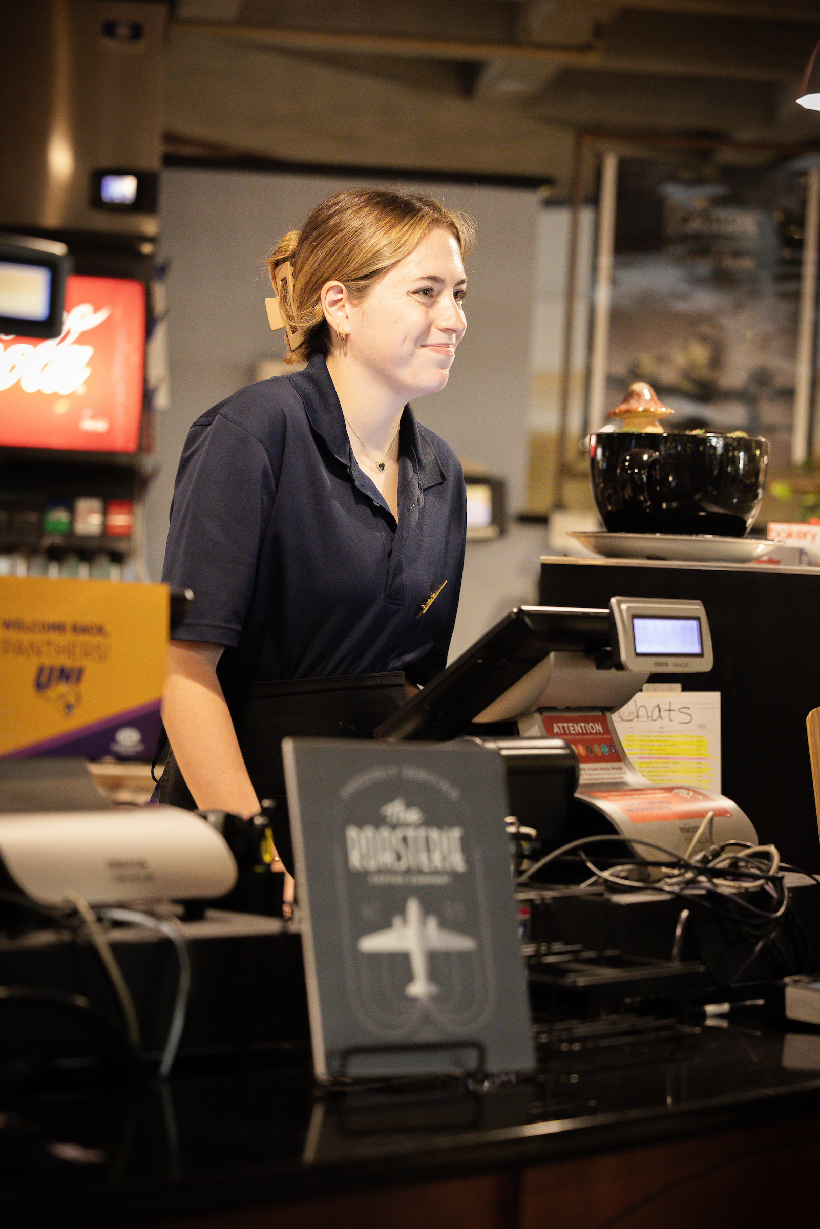 Student employee working at cash register